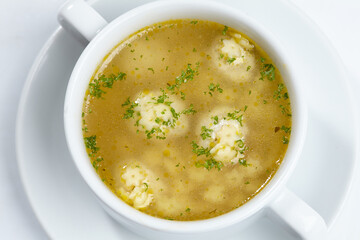 soup with meatballs on the white