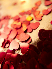 hearts confetti on the golden background