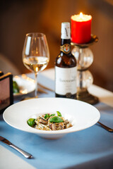 Tagliatelle with wild mushrooms in a white plate