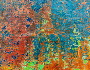 Metal painted at different times with different colors and exposed to weathering. Abstract image for background.