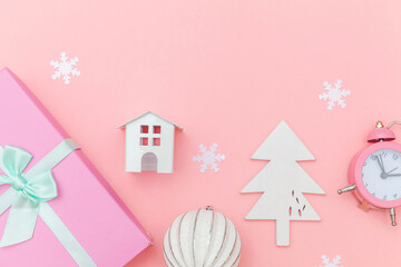 Simply minimal composition winter objects ornament sled fir tree ball gift box isolated on pink pastel trendy background