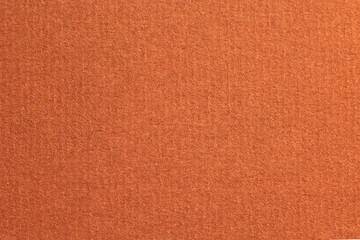Red laid textured paper cardboard background close up