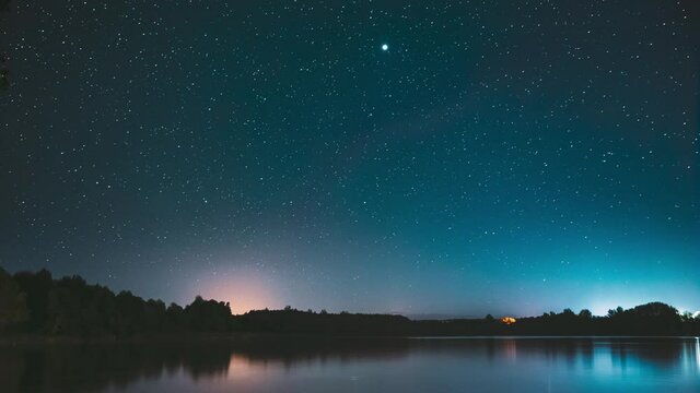 Lyepyel District, Vitebsk Province, Belarus. Real Colorful Night Stars Above Lepel Lake. Natural Starry Sky Background Backdrop Landscape. Time lapse. 4K