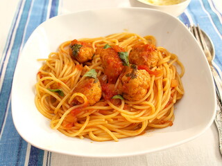 Spaghetti with meatballs in tomato sauce