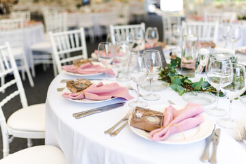 Luxury wedding table decoration in pink and white. Special event table set up. Fresh flower decoration.