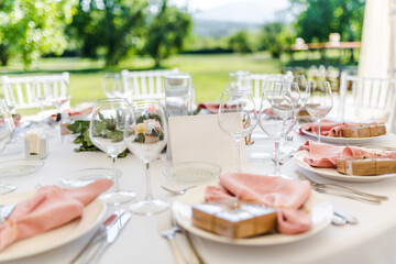 Luxury wedding table decoration in pink and white. Special event table set up. Fresh flower decoration.