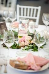 Luxury wedding table decoration in pink and white. Special event table set up. Fresh flower decoration.
