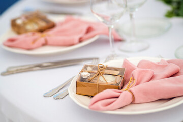 Luxury table set up for a special event - pink napkins and  candles decoration.