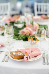 Luxury wedding table decoration in pink and white. Special event table set up. Fresh flower decoration.