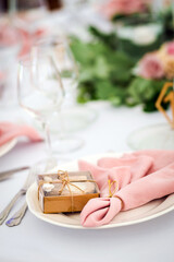 Luxury wedding table decoration in pink and white. Special event table set up. Fresh flower decoration.