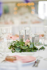 Luxury wedding table decoration in pink and white. Special event table set up. Fresh flower decoration.