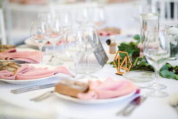 Luxury wedding table decoration in pink and white. Special event table set up. Fresh flower decoration.