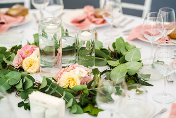 Luxury wedding table decoration in pink and white. Special event table set up. Fresh flower decoration.