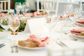 Luxury wedding table decoration in pink and white. Special event table set up. Fresh flower decoration.
