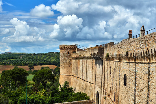 Medieval Fortified Tower And Rural Landscape With Olives In Tuscan