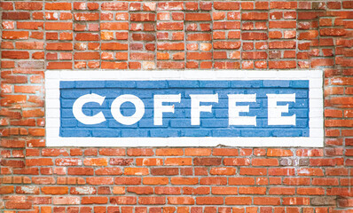 Brick Wall with Blue Painted Sign