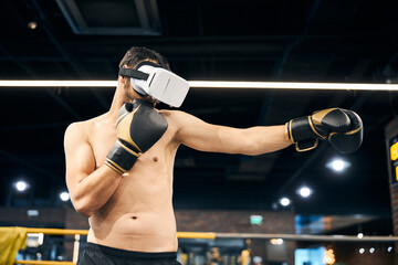 Fototapeta na wymiar Sportsman doing shadow boxing in virtual reality headset