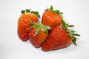 Strawberry with green leaves and white background