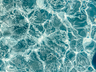 Pool water texture.  Background in summer vacation concept.  Photo of water.