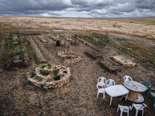 Drone photo of beautiful permaculture garden with seating area