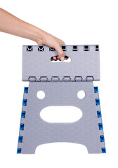 Hand with modern folding plastic chair. Isolated on white background.