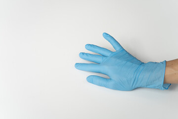 COVID, COVID-19 PPE Blue Latex Glove on Lady's Hand, On White Background