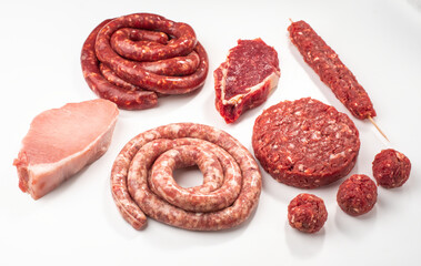 Top view on variety of semi-finished meat products on white back