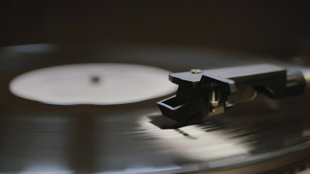Vinyl record is spinning. Old retro turntable.Turntable stylus on a record