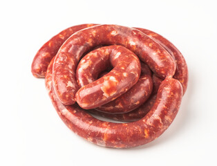 Top view on a roll of beef sausages on white background