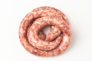 Top view on a rolled beef sausage on white background