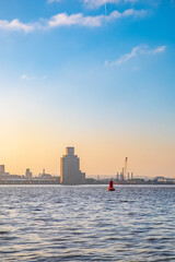 Liverpool, UK. Beautiful colorful long exposure shot of river Mersey from Albert Dock with smooth reflections of night lights from the other side of a shore. 