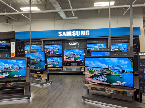 Samsung Logo and QLED TV inside Best Buy Store