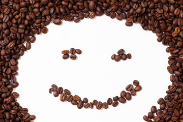 Smile laid out from coffee beans. Smiling roasted coffee. Coffee beans are laid out in the form of a smile