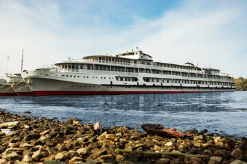 Several cruise ships are moored to the shore