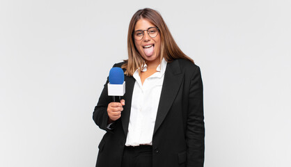 young woman reporter with cheerful, carefree, rebellious attitude, joking and sticking tongue out,...