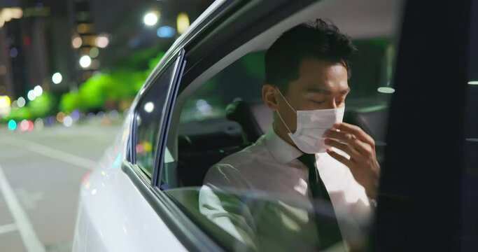 businessman wear mask in car