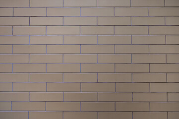 Obraz premium Background wall of modern grey bricks fastened with cement, horizontal orientation