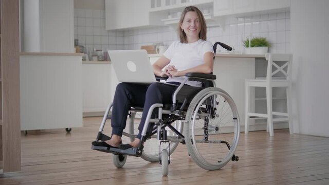 Portrait of young woman in wheelchair