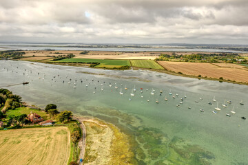 Estuary and yachts surrounded by the beautiful countryside of Southern England.