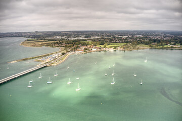 Langstone Harbour aerial photo with the road bridge and yachts in view approaching Langstone Marina.