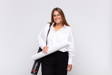 young architect woman smiling happily with a hand on hip and confident, positive, proud and...