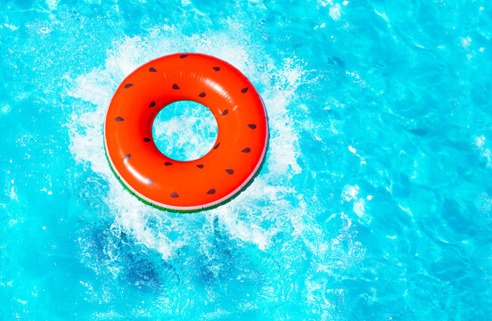 Inflatable Red Watermelon With Seeds Buoy Splash Fall Into The Swimming Pool View From Above