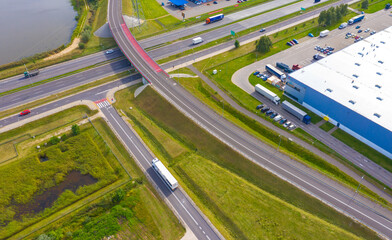 Aerial view of storage and freight terminal with trucks and containers. Industrial background. Logistic center.