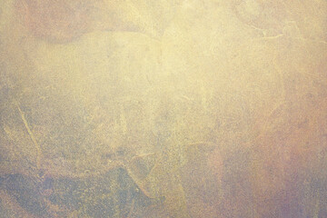 Golden grunge background of shiny paint stains.