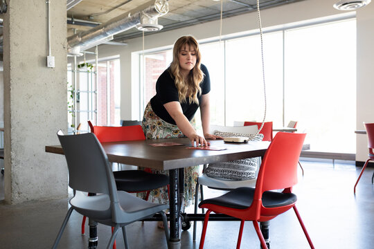 Woman preparing for business meeting in coworking space