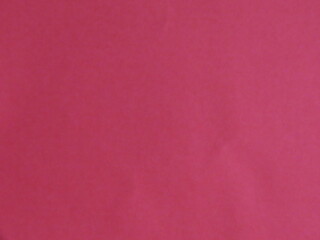 Beautiful background from crimson paper close-up.