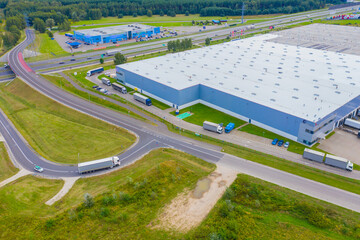 Aerial view of goods warehouse. Logistics center in industrial city zone from drone view....