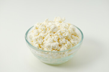 A glass bowl with cotton cheese