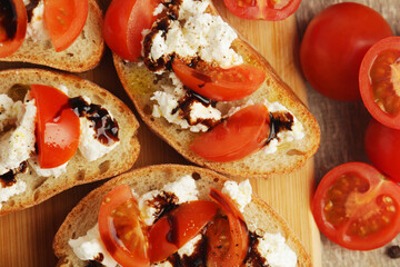 Sandwiches with tomatoes, homemade cheese, olive oil and balsamic sauce