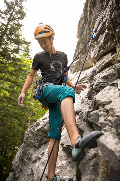 Young Man Rock Climbing